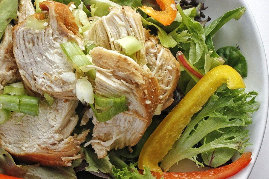 Healthy Teriyaki Chicken Recipe Close Up of a Bowl of Salad Topped with Teriyaki Chicken and Bell Pepper Strips