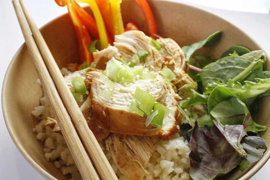 Healthy Teriyaki Chicken Recipe Close Up of a Bowl of Brown Rice and Teriyaki Chicken with Chopsticks