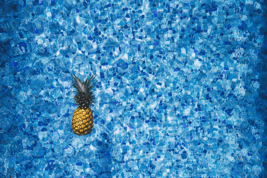 Blue Jello Shot Recipes View of a Blue Pool with a Pineapple Floating in the Water