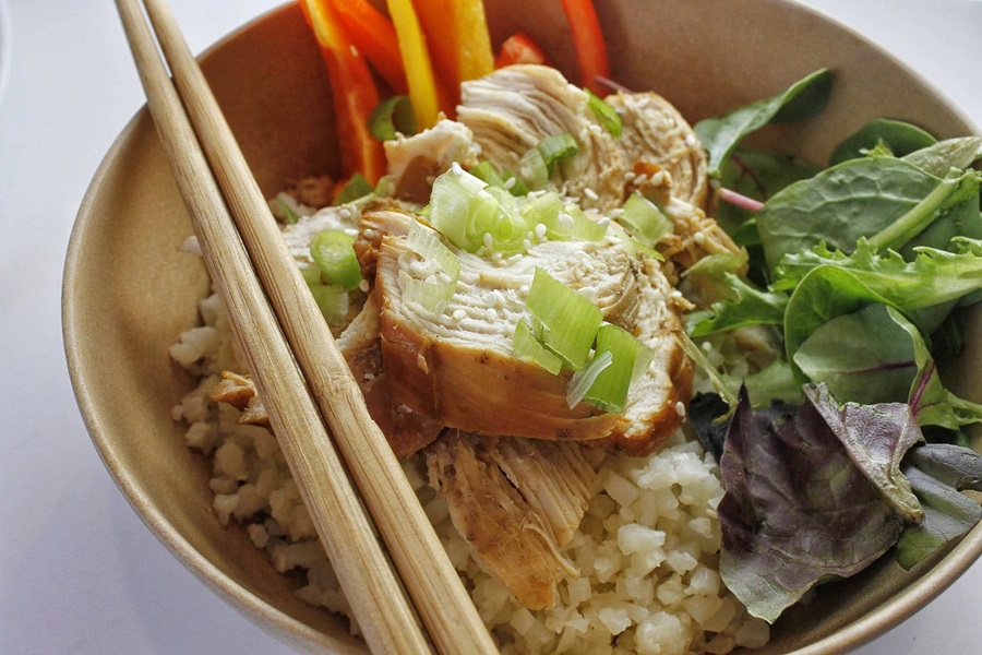 Healthy Teriyaki Chicken Recipe Close Up of a Bowl of Brown Rice Topped with Teriyaki Chicken and Some Greens