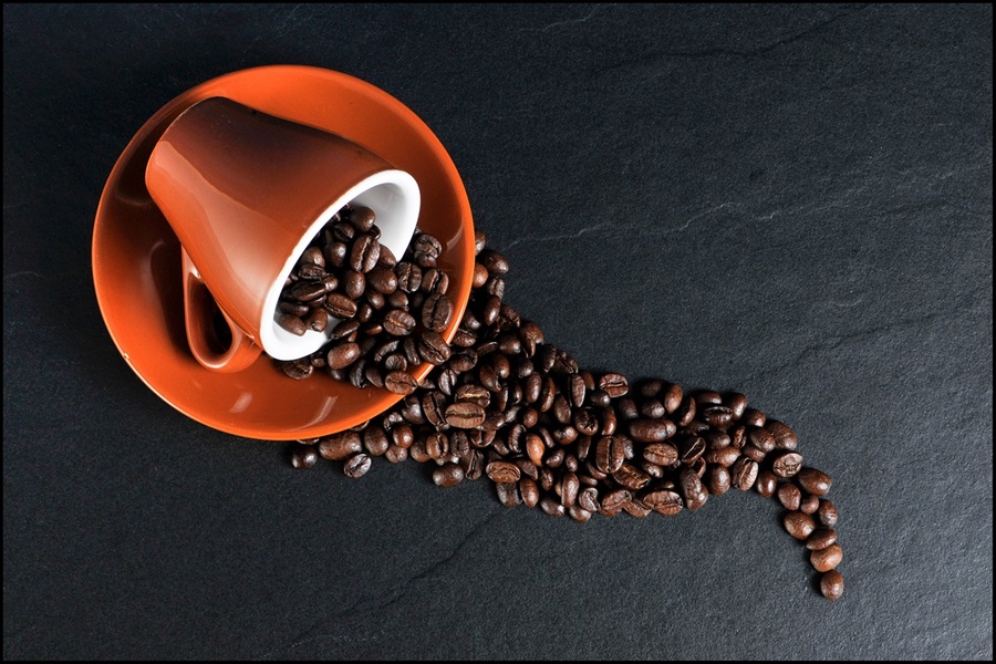 Best Coffee Wine Bar Ideas a Coffee Mug Spilled Over on a Black Surface of Coffee Beans