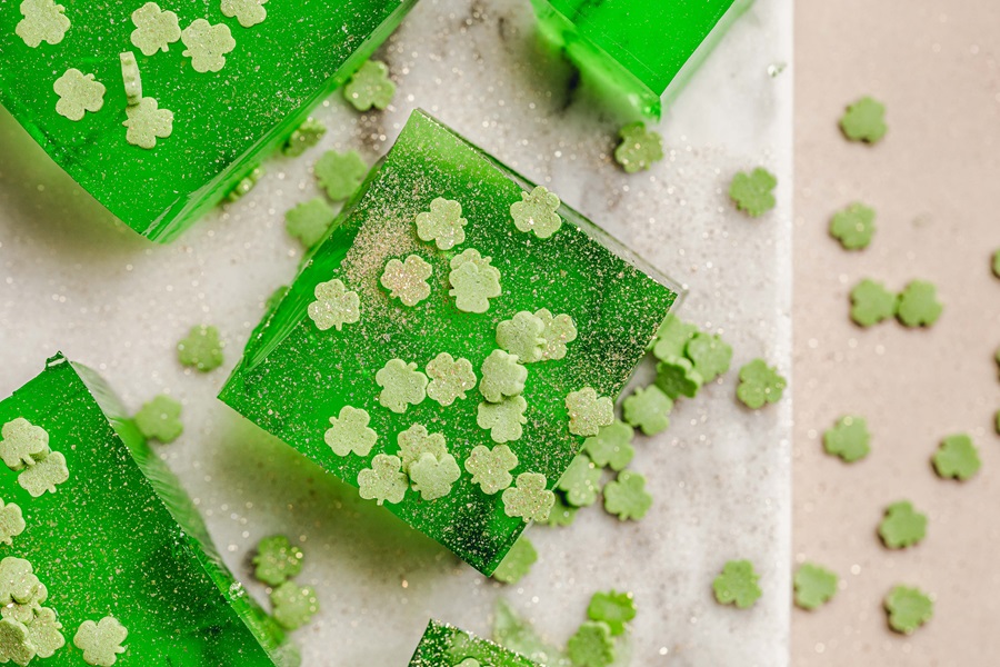 How Many Jello Shots Equal One Shot Close Up of Green Jello Shots with Clover Sprinkles
