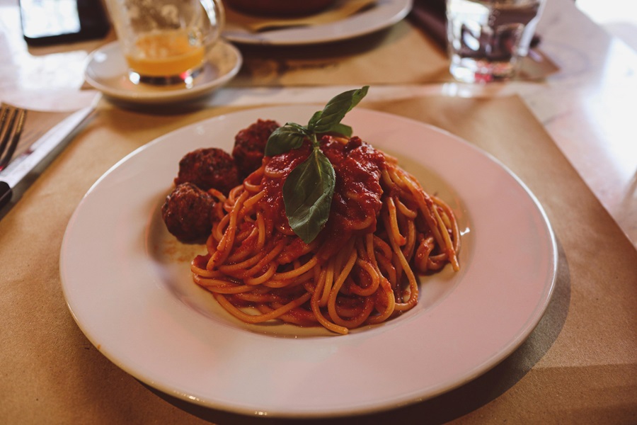 Easy Instant Pot Spaghetti and Meatballs Recipes Close Up of a Plate of Spaghetti and Meatballs on a Wooden Table