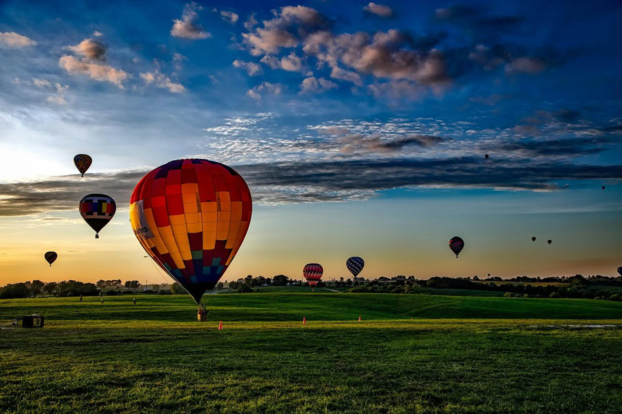Inspirational Hot Air Balloon Quotes and Sayings Hot Air Balloons on a Grassy Field During Sunrise