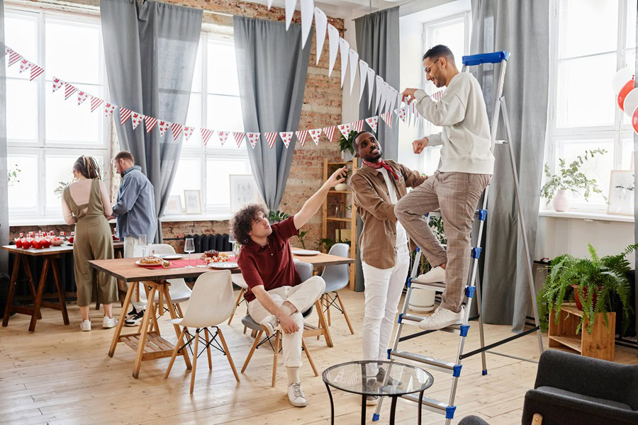 Casual Dinner Party Menu Ideas Three People Setting Up Decorations for a Dinner Party
