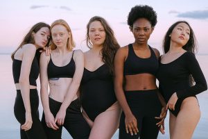Inspiring Body Positivity QuotesA Group of Women Standing Next to Each Other Outside