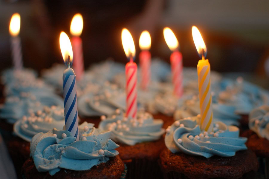 1st Birthday Party Ideas for Boys Close Up of Cupcakes with Blue Icing and Candles in Each One