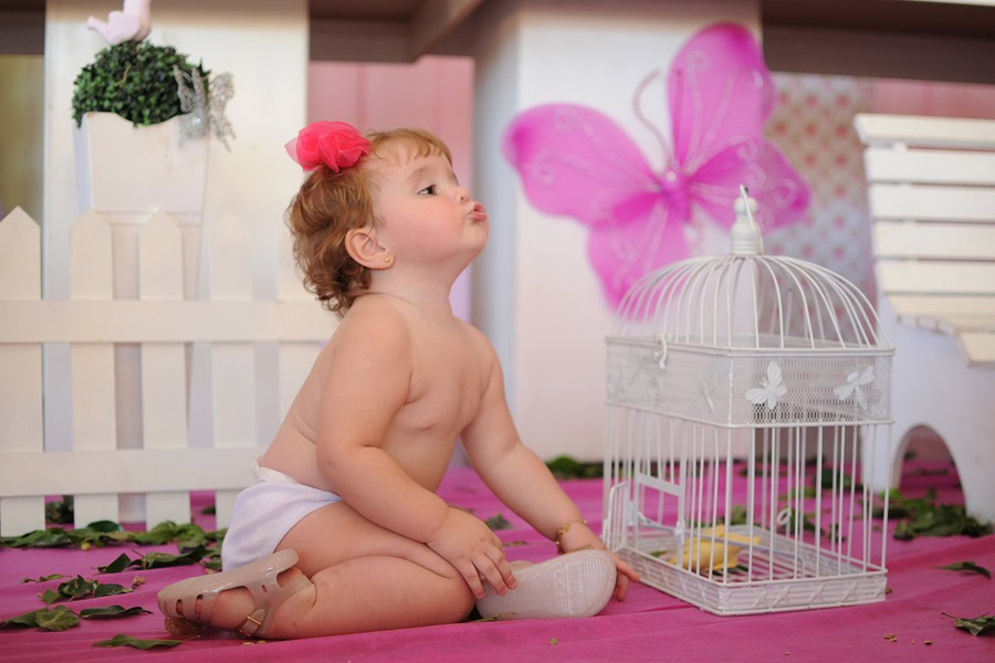 1st Birthday Party Ideas for Girls a Little Girl Posing with a White Bird Cage with a Pink Butterfly on Top