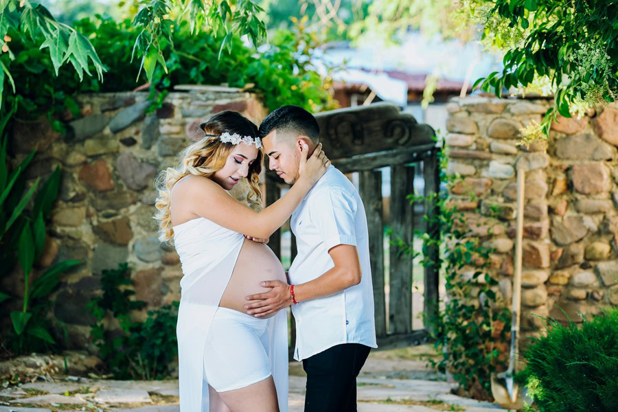 Inspiring Couple Maternity Quotes a pregnant Woman and Her Partner Standing Together in a Romantic Pose for a Picture in Front of a Beautiful Natural Backdrop