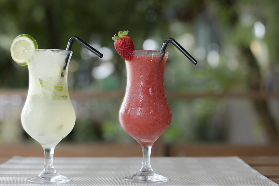 How to Batch Cocktails Close Up of Two Cocktails on a Table Outside