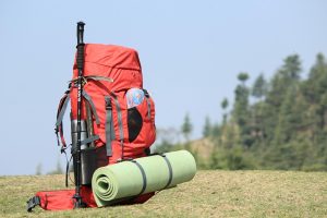 Funny Backpacking Quotes Close Up of an Orange Hiking Backpack Loaded Up with Hiking Gear