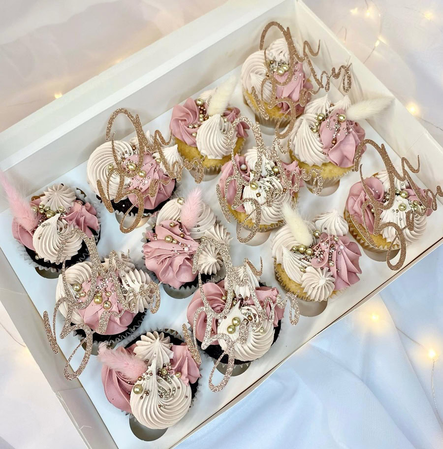 Baby Shower Cakes for Girls View of an Open Box Filled with Pink and White Cupcakes