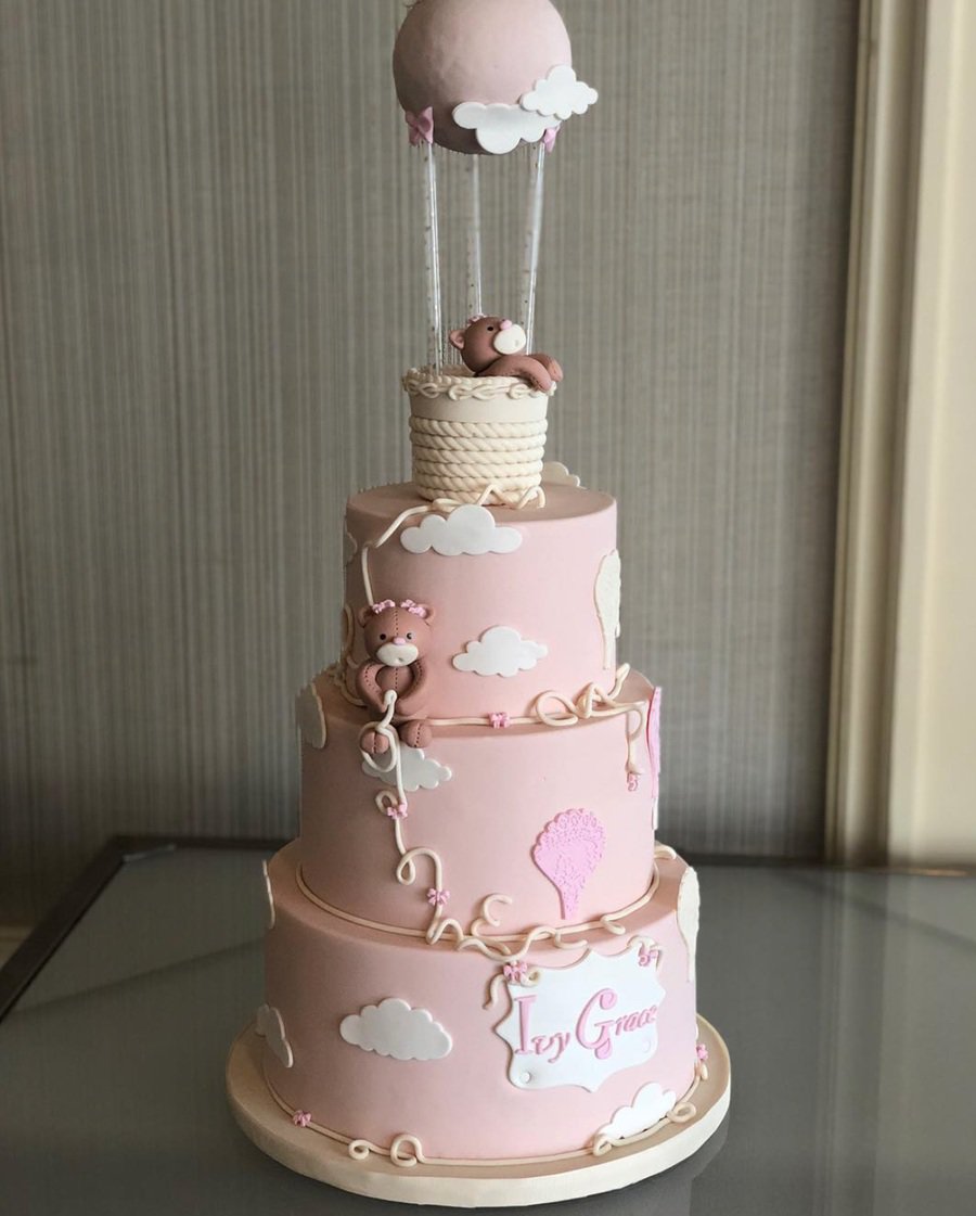 Baby Shower Cakes for Girls Cloe Up of a Three-Tiered Cake with Teddy Bears On Top