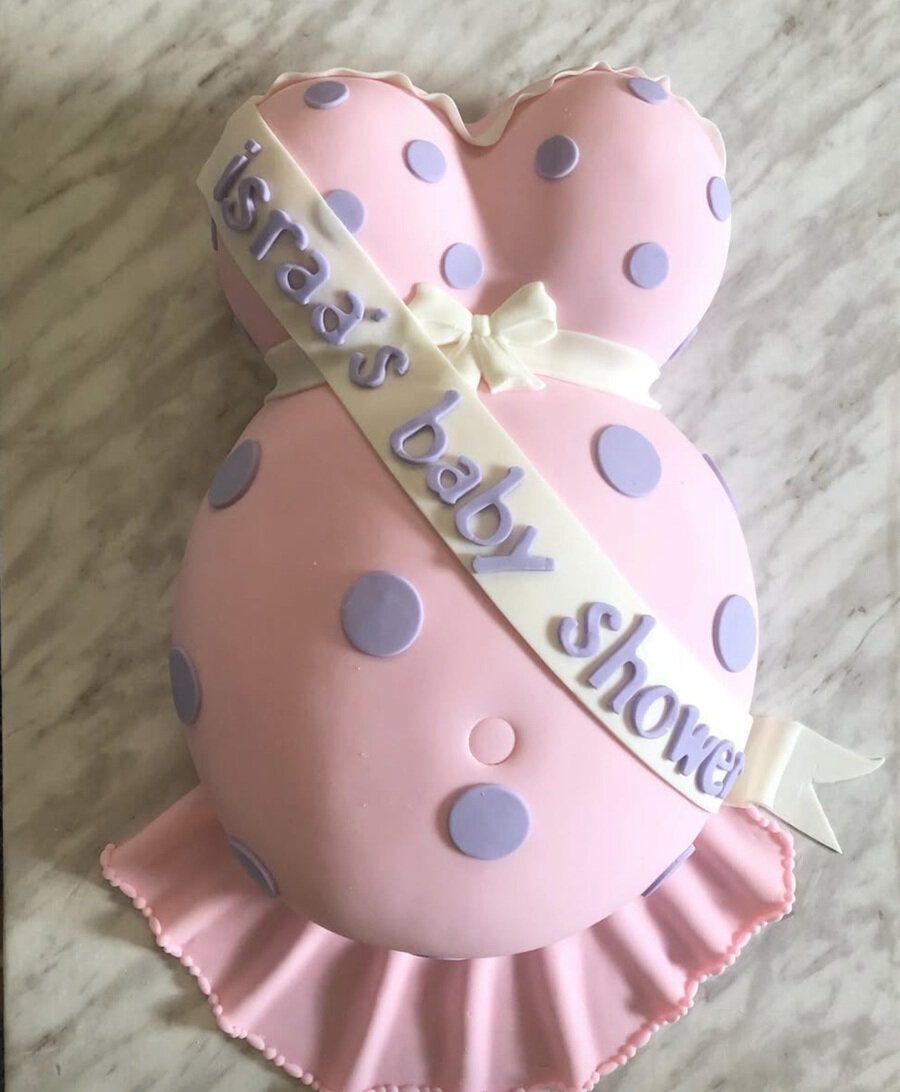 Baby Shower Cakes for Girls a Cake Made to Look Like a Pregnant Belly in a Pink Dress with Polka Dots and a Shash