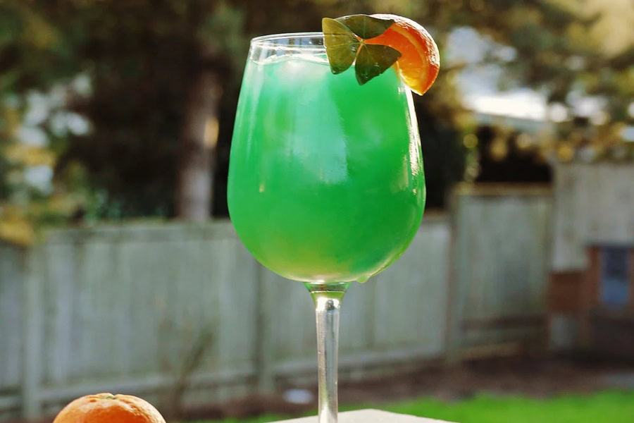 Green Cocktails for St Patricks Day a Green Cocktail Garnished with a Fruit Slice and a Shamrock