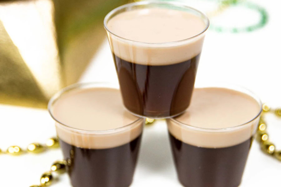 Green Cocktails for St Patricks Day Three Irish Coffee Jello Shots Stacked Like a Pyramid