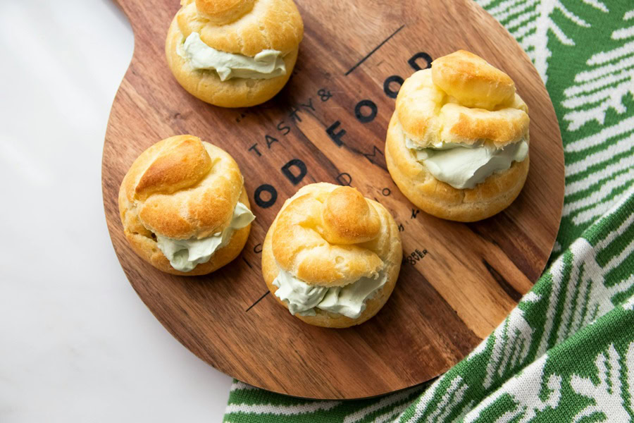 Puff Pastry Appetizer Recipes Cream Puffs on a Wooden Serving Tray