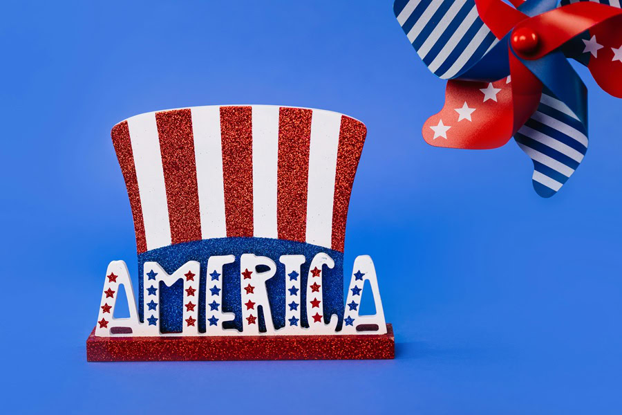 4th of July Cookies Close Up of a Top Hat with Red, White and Blue Stripes and a Pinwheel in the Same Colors