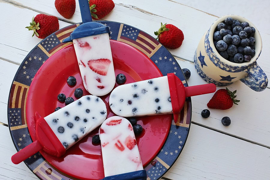 Patriotic Puns View of White Popsicles Filled with Red and Blue Fruit on a Plate