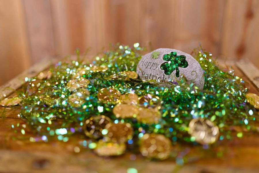 Easy St Patricks Day Party Recipes Green, Silver, and Gold Tinsel with Gold Coins and Shamrocks on a Table