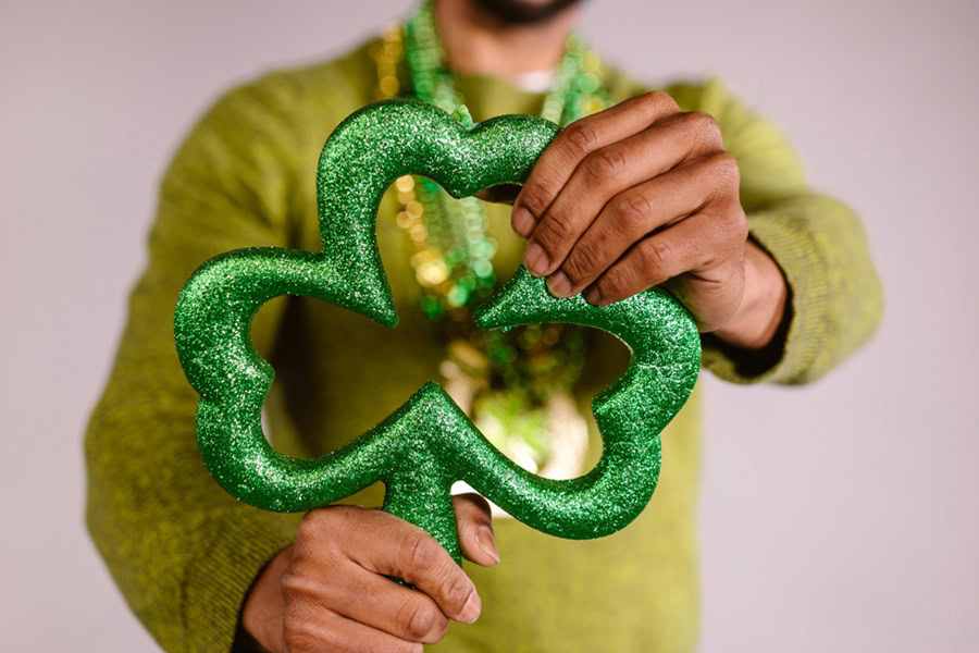 Easy St Patricks Day Party Recipes a Person Holding Up and Out a Sparkly Shamrock Decoration 