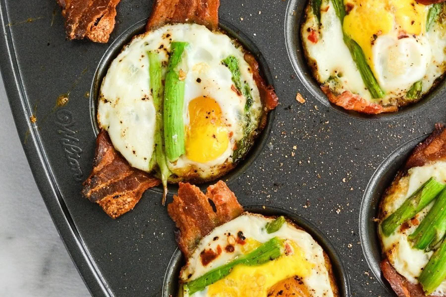 Whole30 Breakfast Recipes Paleo Egg Bites in Cupcake Slots on a Cupcake Baking Tray with Bacon and Green Onions