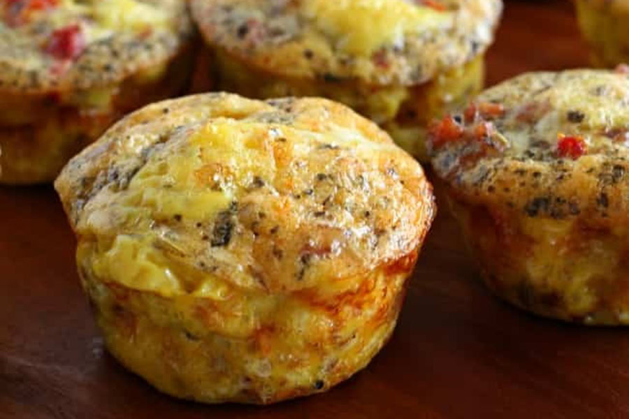 Whole30 Breakfast Recipes Close Up of an Egg Muffin with Sausage Inside