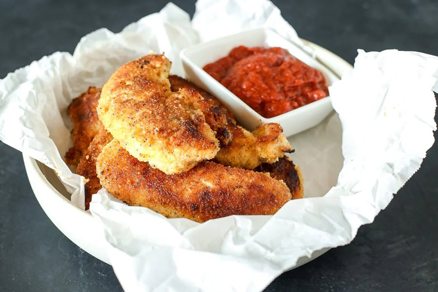 Whole30 Lunch Recipes Whole30 Chicken Tenders in a Basket with a Paper Base and a Small Ramekin of Ketchup