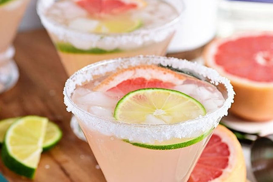 Tequila Drinks That Aren&rsquo;t Margaritas Perfect Paloma Cocktail Recipe in Glasses with Lime Wedges and Salted Rims