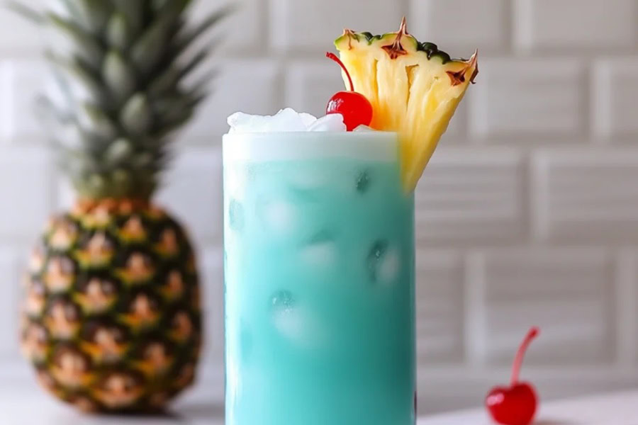 Tequila Drinks That Aren&rsquo;t Margaritas Blue Hawaiian Long Island Garnished with a Pineapple Wedge and a Cherry