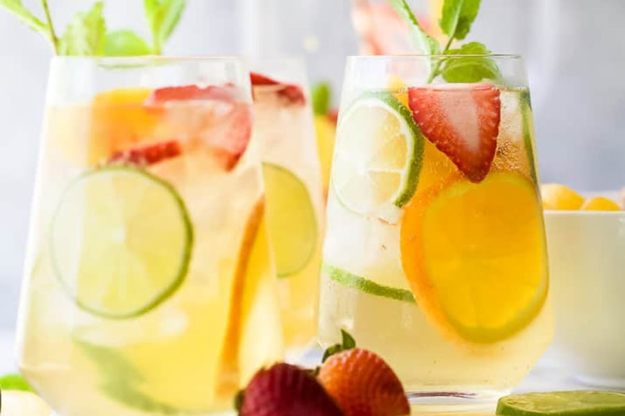 Sangria Recipes Strawberry Peach Moscato Sangria in Wine Glasses with Fruit Slices