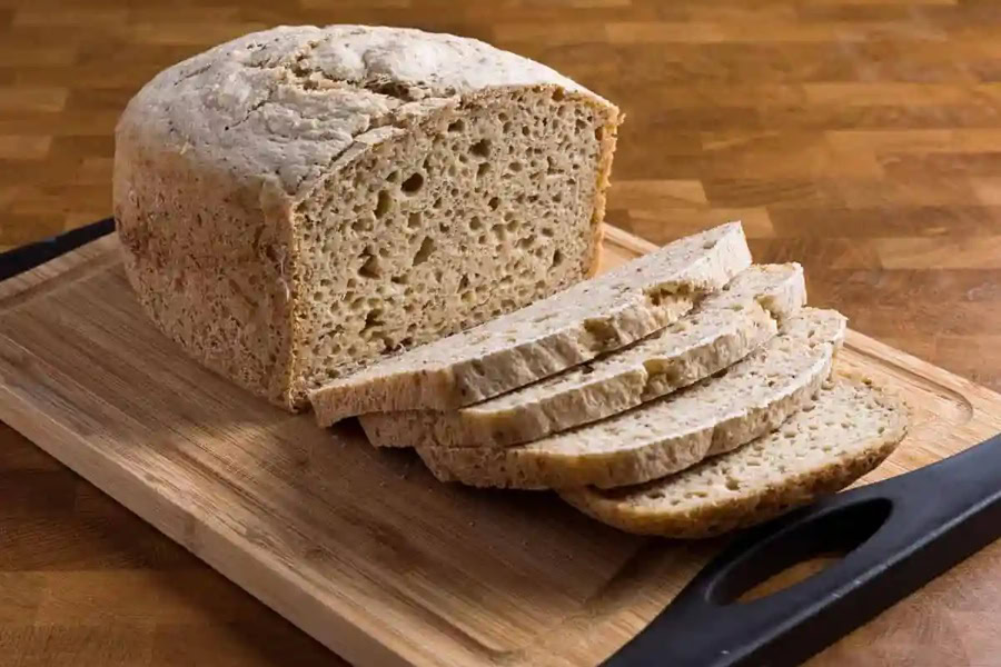 Gluten Free Bread Machine Recipes Vegan Gluten-Free Bread Machine Loaf on a Cutting Board with a Few Slices