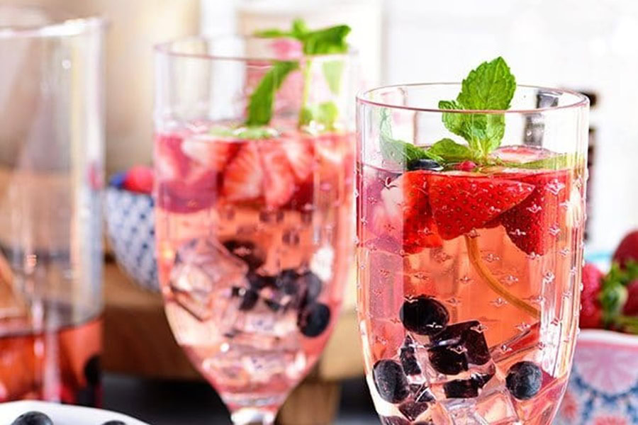 Sangria Recipes Rosé Summer Sangria with Berries in Two Glasses with Fresh Fruit