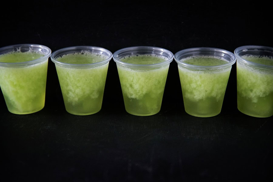 Tequila Jello Shot Recipes Key Lime Margarita Jelly Shots in a Row Against a Black Background