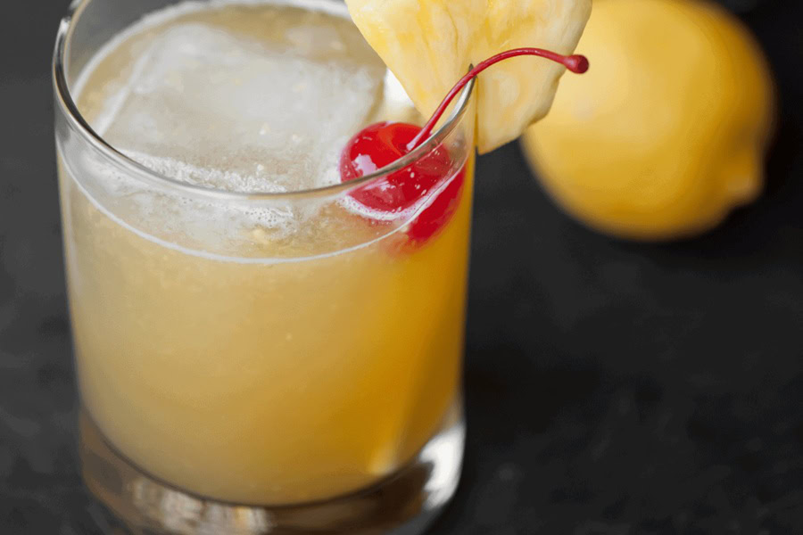 Whiskey Drinks for Summer Hawaiian Stone Sour in a Glass with a Cherry