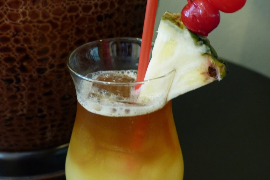 Backyard BBQ Drinks for an Outdoor Party Easy Mai Tai Recipe Garnished with a Pineapple Wedge and Some Cherries