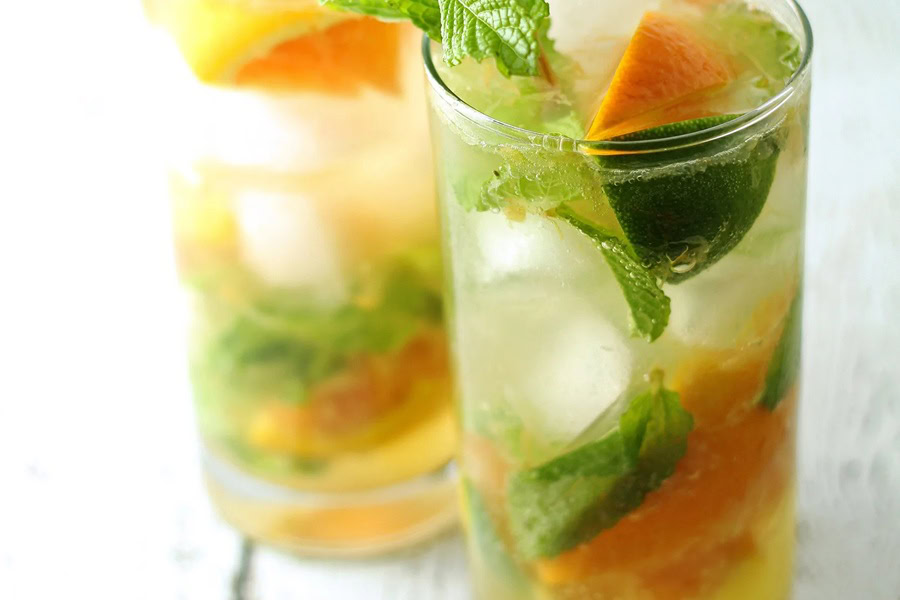 Backyard BBQ Drinks for an Outdoor Party Two Glasses Filled with Refreshing Orange Mojito Recipe