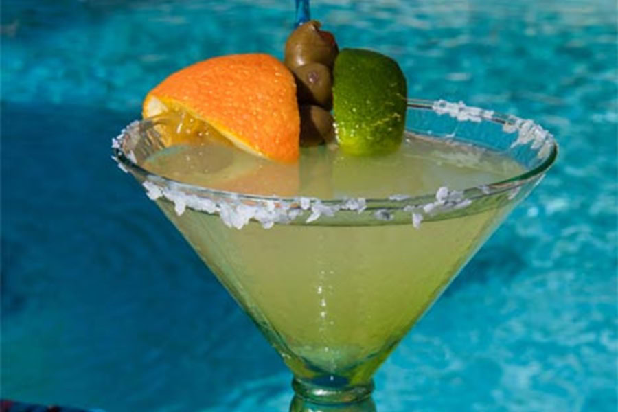Backyard BBQ Drinks for an Outdoor Party Mexican Martini Recipe in a Martini Glass by a Pool