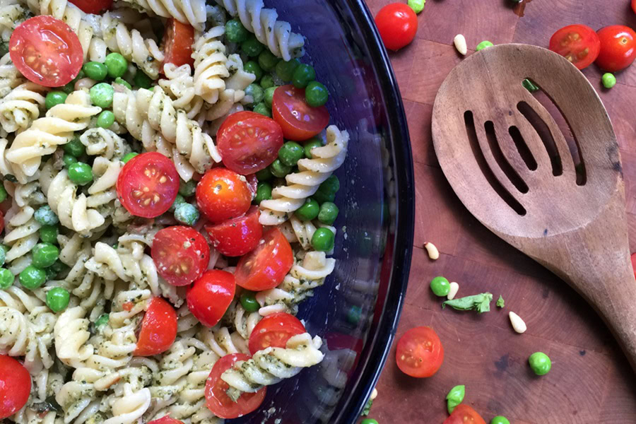 Best Side Dishes for a BBQ Basil Pesto Pasta Salad Recipe in a Blueish Glass Bowl