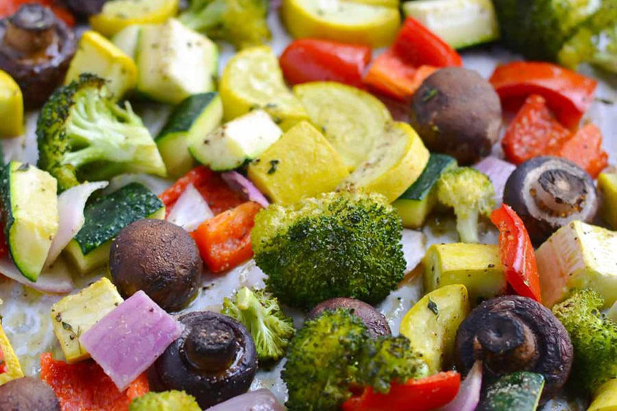 Best Side Dishes for a BBQ Close Up of Rainbow Roasted Vegetables on a Sheet Pan