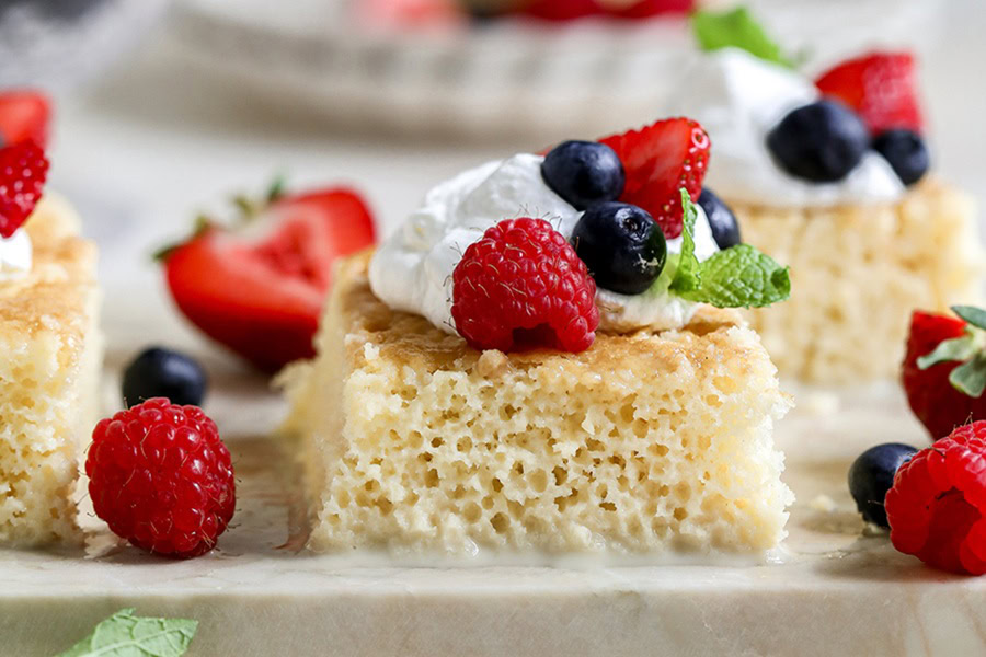 Red White and Blue Desserts Tres Leches Cake with Fresh Berries Topped with Strawberries, Blueberries, and Whipped Cream
