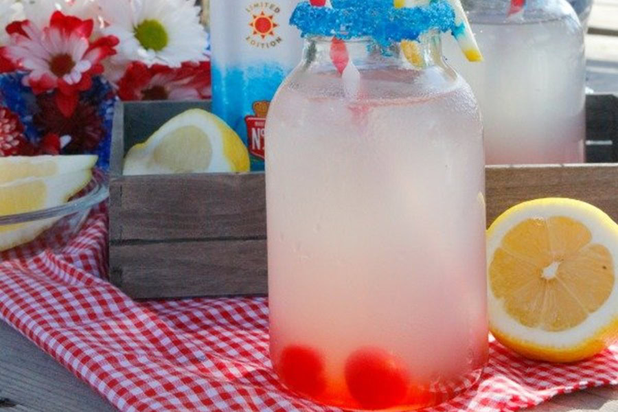Red White and Blue Drink Recipes with Alcohol Boozy Sparkling Lemonade in a Mason Jar Glass