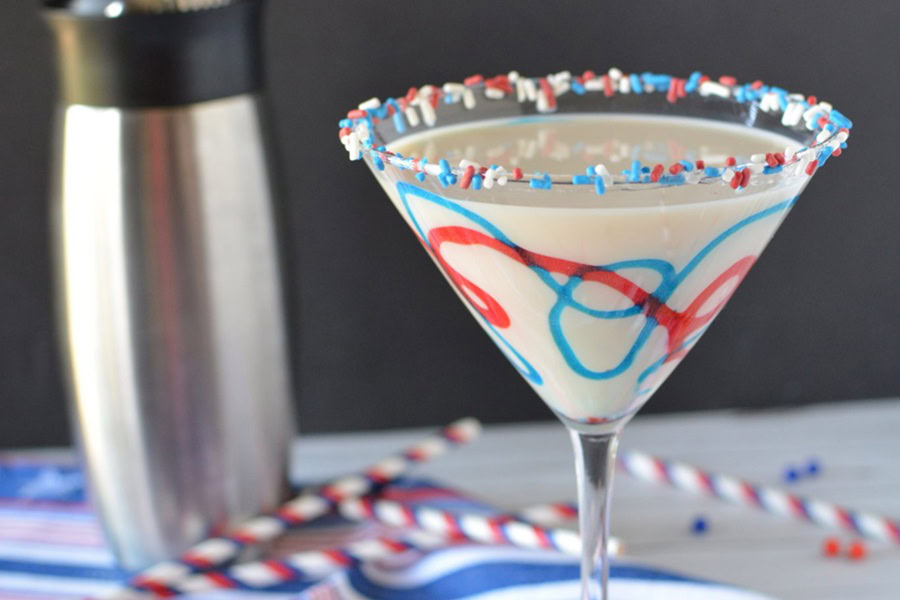 Red White and Blue Drink Recipes with Alcohol Firecracker Martini in a Martini Glass Next to a Cocktail Shaker