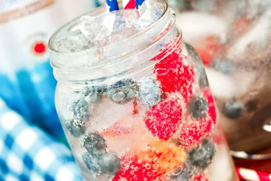 Red White and Blue Drinks Red White & Blueberry Lemonade in a Mason Jar Glass