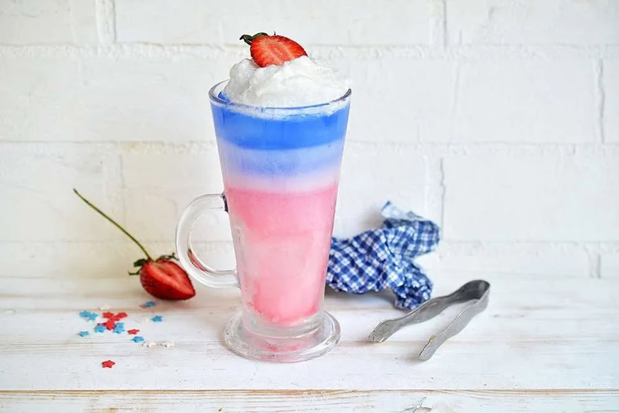 Red White and Blue Drinks Red White and Blue Italian Sodas on a White Counter Top