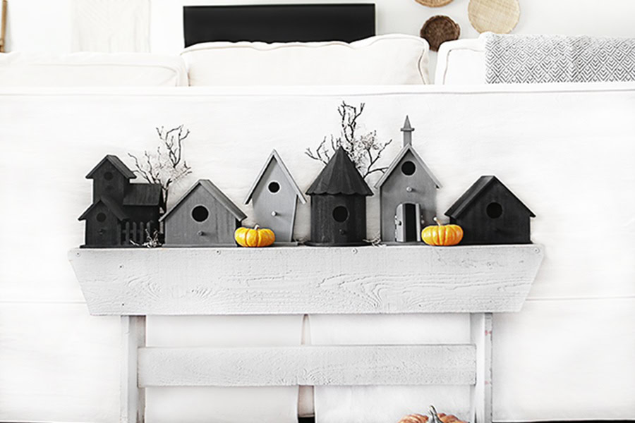 Halloween Decorations for a Spooky Party DIY Halloween Vignette using Birdhouses Behind a White Couch