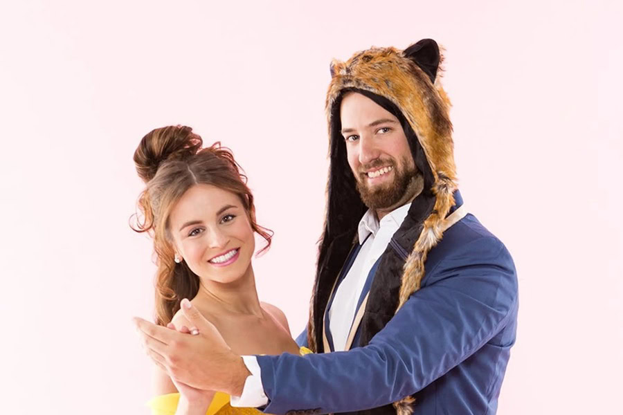 DIY Couple Halloween Costume Ideas a Man Dressed as Beast and a Woman Dressed as Belle Dancing Together and Posing for a Camera