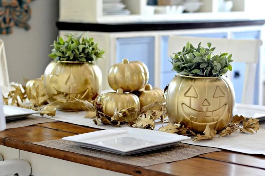 Halloween Decorations for a Spooky Party DIY Spray-Painted Pumpkins on a Kitchen Counter